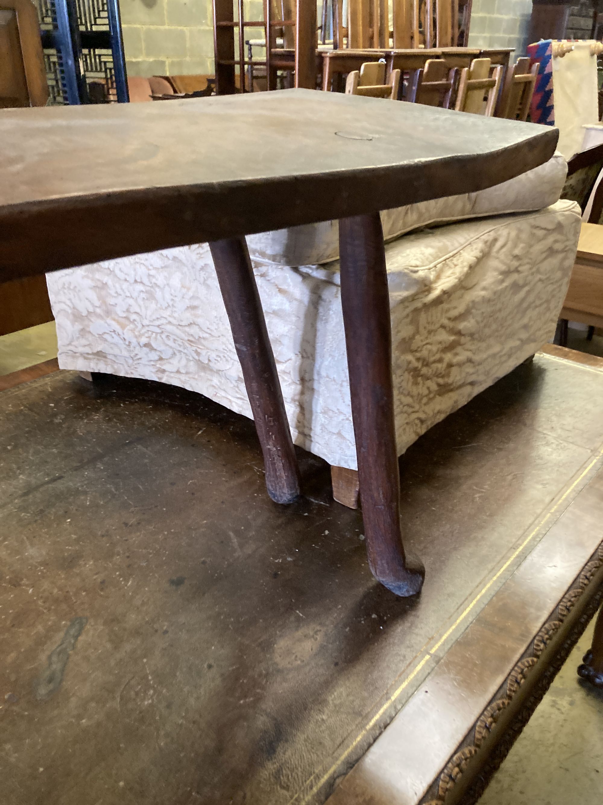 A small 19th century elm bench, on pegged legs, length 101cm, depth 30cm, height 49cm